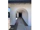 Covered entryway with arch and decorative stone accent at 8133 W Mclellan Rd, Glendale, AZ 85303