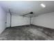Spacious garage with concrete floors, overhead lighting, and an automatic door opener at 8133 W Mclellan Rd, Glendale, AZ 85303