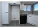 Updated kitchen featuring white cabinets, stainless steel appliances, and gray tile backsplash at 8133 W Mclellan Rd, Glendale, AZ 85303