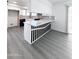 Modern kitchen island featuring a white countertop and unique black and white detailing at 8133 W Mclellan Rd, Glendale, AZ 85303