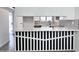 Modern kitchen pass-through with stylish black and white accents and white countertops at 8133 W Mclellan Rd, Glendale, AZ 85303