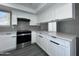 Kitchen featuring new countertops, stainless oven, and white cabinets at 8133 W Mclellan Rd, Glendale, AZ 85303