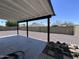 Covered patio with concrete slab and a gravel yard, perfect for outdoor entertaining at 8133 W Mclellan Rd, Glendale, AZ 85303