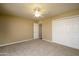 Bedroom featuring carpet flooring, white trim, a closet, and ceiling fan at 8230 E Navarro Ave, Mesa, AZ 85209