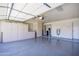 Spacious garage with sealed floors and plenty of cabinet storage at 8230 E Navarro Ave, Mesa, AZ 85209