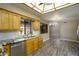 Bright kitchen with wood cabinetry, granite countertops, stainless steel appliances, and neutral backsplash at 8230 E Navarro Ave, Mesa, AZ 85209
