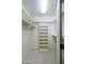 Walk-in closet with built in shelves and neutral walls at 8230 E Navarro Ave, Mesa, AZ 85209