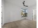 Clean bedroom with a window showing a desert landscape and hard wood floors at 9441 N 129Th Pl, Scottsdale, AZ 85259