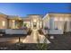 Stunning home exterior with modern architectural details, a pathway, and professionally landscaped grounds at 9441 N 129Th Pl, Scottsdale, AZ 85259