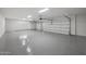 Spacious three car garage offering ample parking and storage space, complete with epoxy flooring at 9441 N 129Th Pl, Scottsdale, AZ 85259