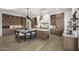 Spacious kitchen with a large island, stylish pendant lights, and wood cabinetry at 9441 N 129Th Pl, Scottsdale, AZ 85259