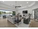 Spacious living room featuring modern decor, a fireplace, and seamless indoor-outdoor flow at 9441 N 129Th Pl, Scottsdale, AZ 85259