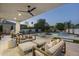 Outdoor patio with comfortable seating, a fireplace, and a view of the pool is perfect for entertaining at 9441 N 129Th Pl, Scottsdale, AZ 85259