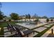 Relaxing pool area features lounge chairs and lush landscaping, perfect for enjoying sunny days and outdoor living at 9441 N 129Th Pl, Scottsdale, AZ 85259