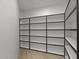 Spacious walk-in closet featuring custom shelving for optimal storage and organization at 9441 N 129Th Pl, Scottsdale, AZ 85259