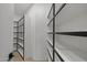 Empty walk-in closet with built-in shelving, ready for organization at 9441 N 129Th Pl, Scottsdale, AZ 85259