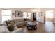 Open-concept living room featuring hardwood floors, natural light, and neutral furnishings at 9791 N 118Th Way, Scottsdale, AZ 85259