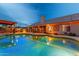 Beautiful pool at twilight reflecting the house, patio and cabana at 10931 N 129Th Way, Scottsdale, AZ 85259
