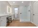 Bathroom boasts a glass shower, light wood floors, and a modern vanity with a stool at 10931 N 129Th Way, Scottsdale, AZ 85259