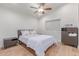 Bedroom featuring a ceiling fan, laminate floors, and a dresser with decor at 10931 N 129Th Way, Scottsdale, AZ 85259