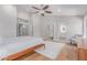 Large primary bedroom featuring hardwood floors, walk in closet, ensuite bathroom and lots of natural light at 10931 N 129Th Way, Scottsdale, AZ 85259