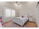 bedroom featuring a ceiling fan, wood floors, and a colorful rug at 10931 N 129Th Way, Scottsdale, AZ 85259