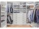 Custom walk-in closet with drawers, shelves, and hanging racks, providing ample storage space at 10931 N 129Th Way, Scottsdale, AZ 85259