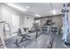Home gym with a variety of weights, treadmill and equipment on a protective rubber floor at 10931 N 129Th Way, Scottsdale, AZ 85259