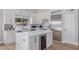 Modern kitchen featuring a center island with a wine cooler and stainless steel appliances at 10931 N 129Th Way, Scottsdale, AZ 85259