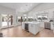 Open concept kitchen featuring a center island, stainless steel appliances and views of outdoor patio at 10931 N 129Th Way, Scottsdale, AZ 85259