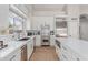 Beautiful modern kitchen with stainless steel appliances and a large quartz countertop at 10931 N 129Th Way, Scottsdale, AZ 85259