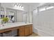 Bathroom with vanity, shower-tub combo, and a view into the main bedroom at 11330 W Eden Mckenzie Dr, Surprise, AZ 85378