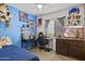Cozy bedroom featuring a spacious layout with decor, desk space, and natural light at 11330 W Eden Mckenzie Dr, Surprise, AZ 85378