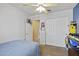 Neutral toned bedroom with ceiling fan and a large closet for ample storage at 11330 W Eden Mckenzie Dr, Surprise, AZ 85378