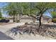 Two-story home featuring a two-car garage and easy-to-maintain desert landscaping at 11330 W Eden Mckenzie Dr, Surprise, AZ 85378