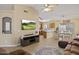 Comfortable living room with modern decor leading to an open kitchen and dining area at 11330 W Eden Mckenzie Dr, Surprise, AZ 85378