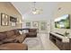 Spacious living room with a plush sectional and a view of the dining area at 11330 W Eden Mckenzie Dr, Surprise, AZ 85378