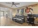 Comfortable living room featuring cozy seating, desk space and easy access to outdoor area at 11330 W Eden Mckenzie Dr, Surprise, AZ 85378