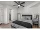 This bedroom features a ceiling fan, wood floors, and en suite bathroom, providing ample space and comfort at 1174 E Belmont Ave, Phoenix, AZ 85020