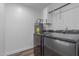 The laundry room features a modern washer and dryer set, cabinets, and water heater at 1174 E Belmont Ave, Phoenix, AZ 85020