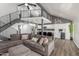 Open floor plan with a spacious living room that includes a modern kitchen and staircase to the second story at 1174 E Belmont Ave, Phoenix, AZ 85020