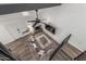 An aerial view of the living room with modern decor, wood floor, vaulted ceilings, and fireplace at 1174 E Belmont Ave, Phoenix, AZ 85020