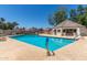 Community pool with sparkling blue water, lounge chairs and a shaded pool house at 1174 E Belmont Ave, Phoenix, AZ 85020