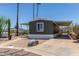 Exterior of a home with extended carport and desert landscaping showcasing the desert lifestyle at 12811 N 19Th Pl, Phoenix, AZ 85022