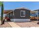 Welcoming home featuring new wooden stairs, an extended carport, and a desert-friendly yard at 12811 N 19Th Pl, Phoenix, AZ 85022