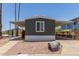 Charming home featuring an extended carport, desert landscaping, and a quaint single window at 12811 N 19Th Pl, Phoenix, AZ 85022