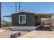 Home exterior features a wide carport and low-maintenance desert landscaping for easy living at 12811 N 19Th Pl, Phoenix, AZ 85022