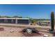 Exterior view of a manufactured home with well maintained gravel yard and desert landscaping and mountain views at 12811 N 19Th Pl, Phoenix, AZ 85022