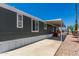 Home exterior highlighting the covered carport and easy-care desert landscape, perfect for desert living at 12811 N 19Th Pl, Phoenix, AZ 85022
