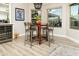 Bright dining area with modern lighting fixture and table with seating for four at 136 E Vera Ln, Tempe, AZ 85284